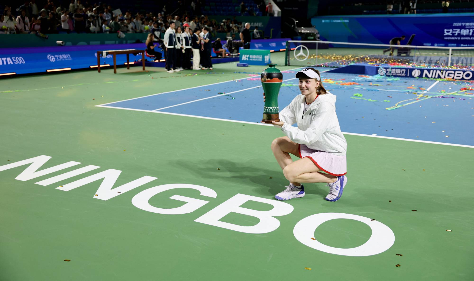 Tennis - WTA 500 - Ningbo Open - Yinzhou Tennis Center, Ningbo, China - October 25, 2026
Kazakhstan's Elena Rybakina celebrates with the trophy after winning the final against Canada's Leylah Fernandez REUTERS/Athit Perawongmetha