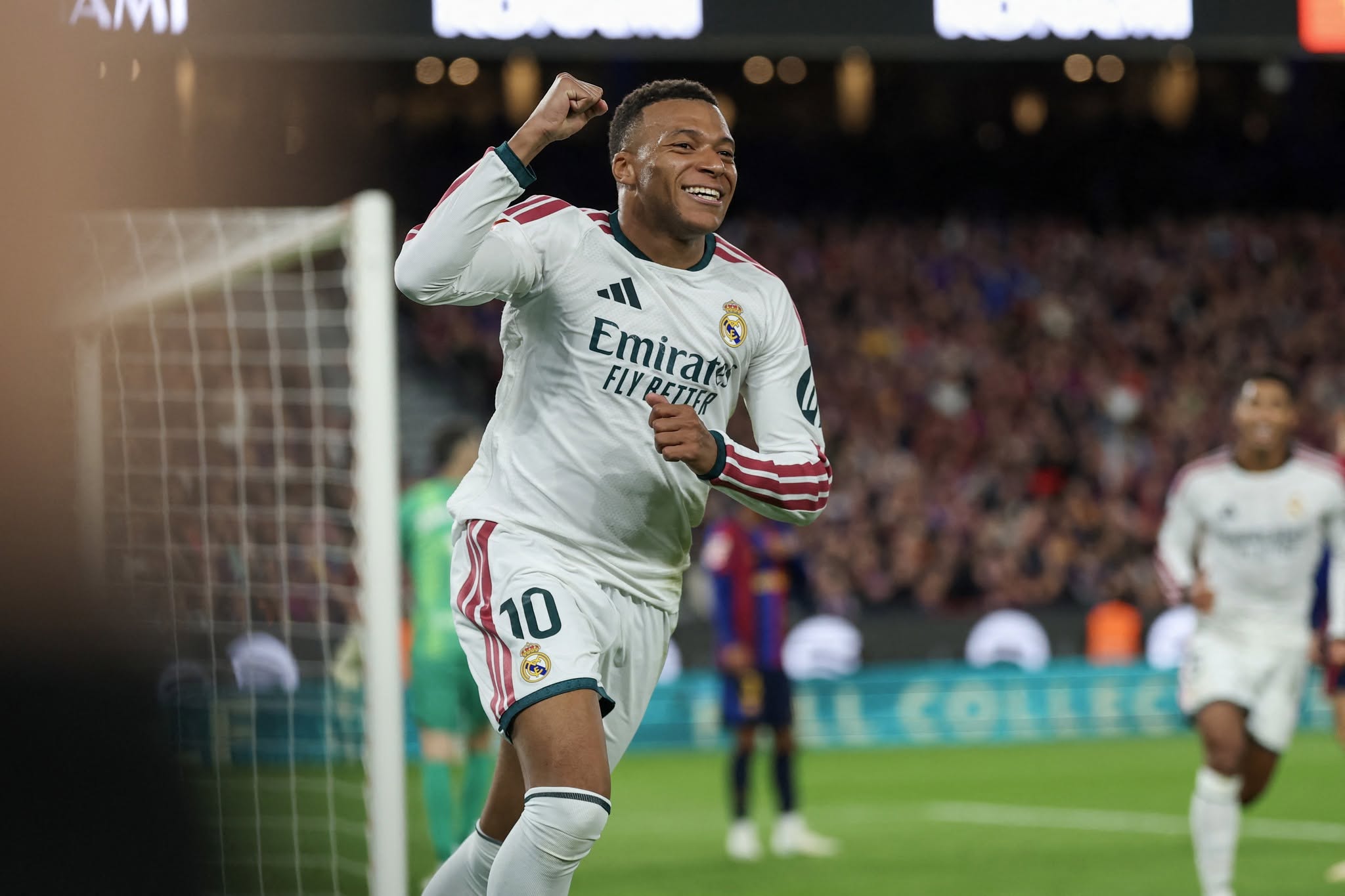 Real Madrid's French forward #10 Kylian Mbappe celebrates scoring his team's first goal during the Spanish league football match between FC Barcelona and Real Madrid CF at Camp Nou Stadium in Barcelona on October 25, 2026. (Photo by Lluis GENE / AFP)