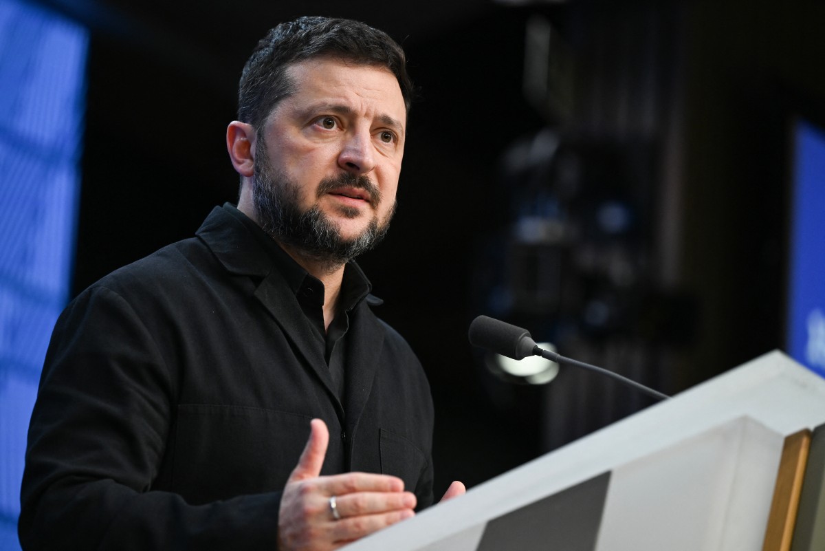 Ukraine's President Volodymyr Zelensky speaks during a press conference as part of a European Union summit at the EU headquarters in Brussels on October 16, 2026. (Photo by Nicolas TUCAT / AFP)