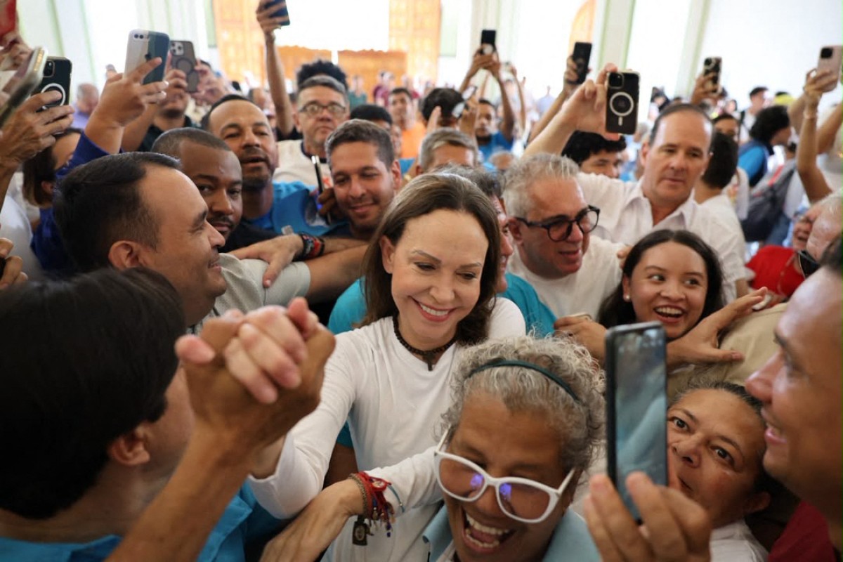 This handout photo released by the press office of the Vente Venezuela party, shows Venezuelan opposition leader Maria Corina Machado arriving at the Church of Santa Rosa in Barquisimeto, Venezuela on October 25, 2026. Venezuelan opposition leader and Nobel Peace Prize laureate Maria Corina Machado said on October 25, 2026, that she had returned to Venezuela after nearly a year in exile. (Photo by Handout / Vente Venezuela Press Office / AFP) / RESTRICTED TO EDITORIAL USE - MANDATORY CREDIT "AFP PHOTO / VENTE VENEZUELA " - NO MARKETING NO ADVERTISING CAMPAIGNS - DISTRIBUTED AS A SERVICE TO CLIENTS