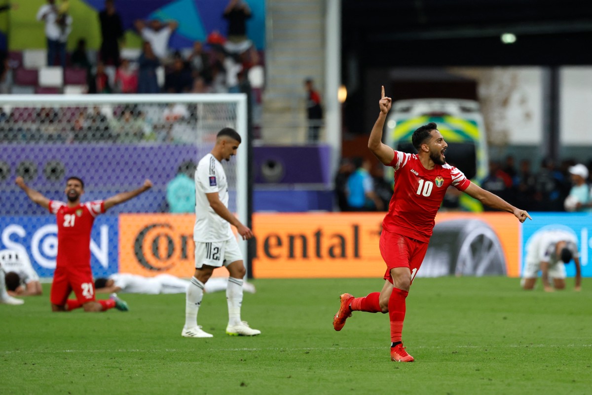 Jordan's midfielder #10 Musa al-Tamari celebrates his team's win at the end of the Qatar 2023 AFC Asian Cup football match between Iraq and Jordan at Khalifa International Stadium in Doha on January 29, 2024. (Photo by KARIM JAAFAR / AFP)